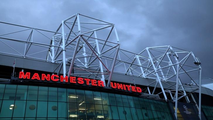 Clouds hanging over Old Trafford with Manchester United sign